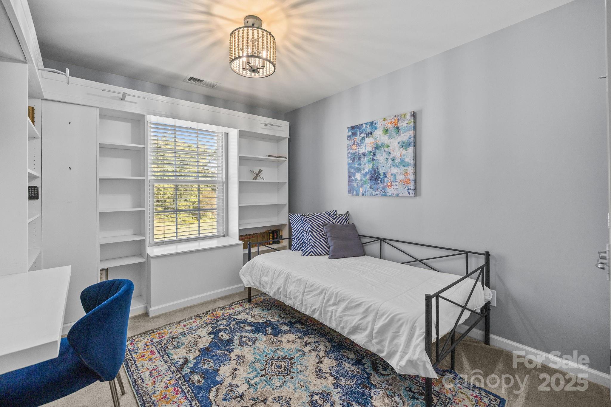 7443 Red Mulberry Way Charlotte, NC 28273 - Photo 39 of 45 a bedroom with a bed and a window