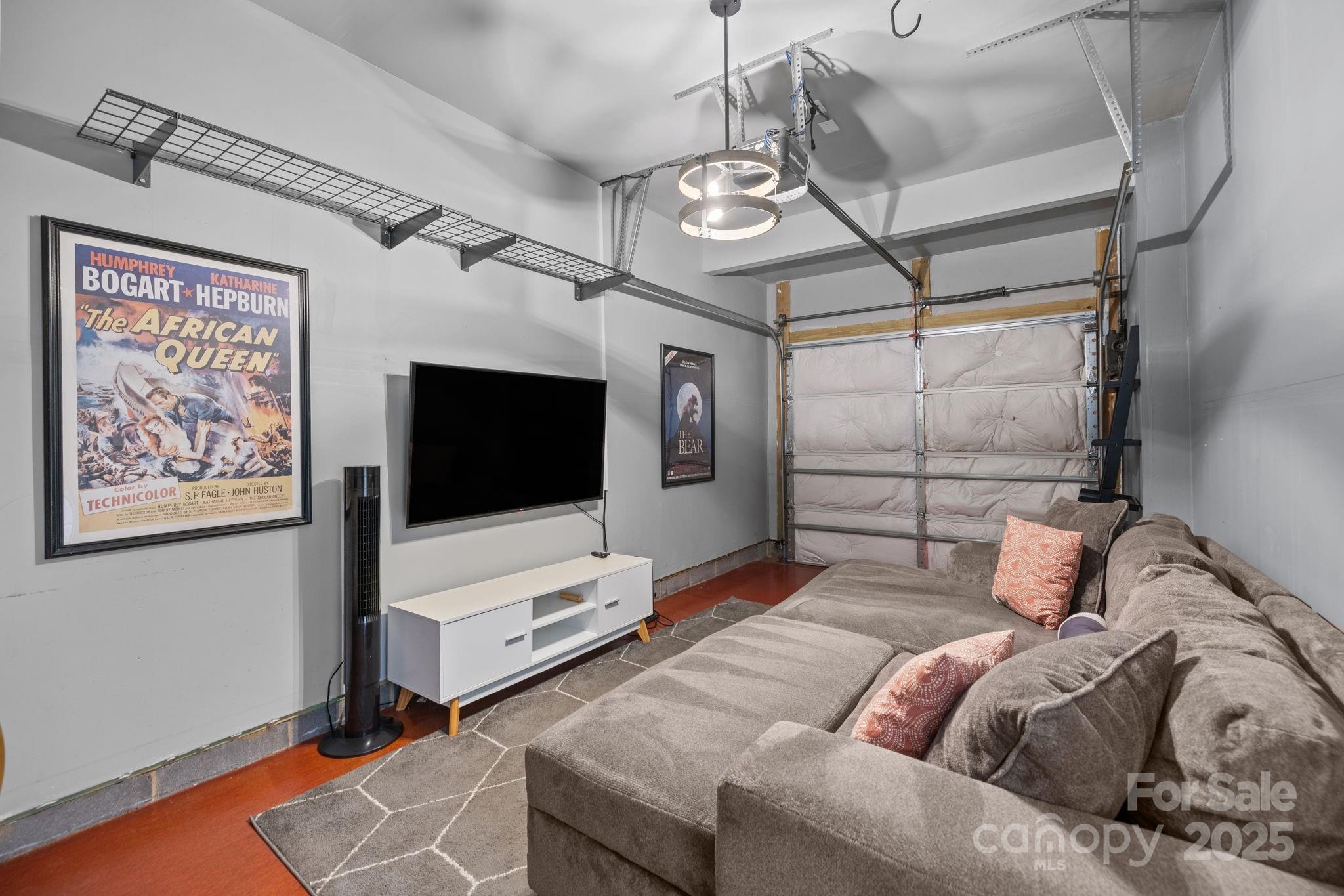 7443 Red Mulberry Way Charlotte, NC 28273 - Photo 44 of 45 a living room with furniture and a flat screen tv