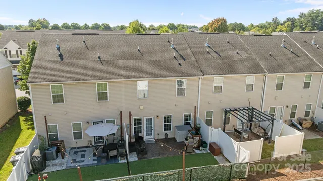 an aerial view of multiple house with outdoor space