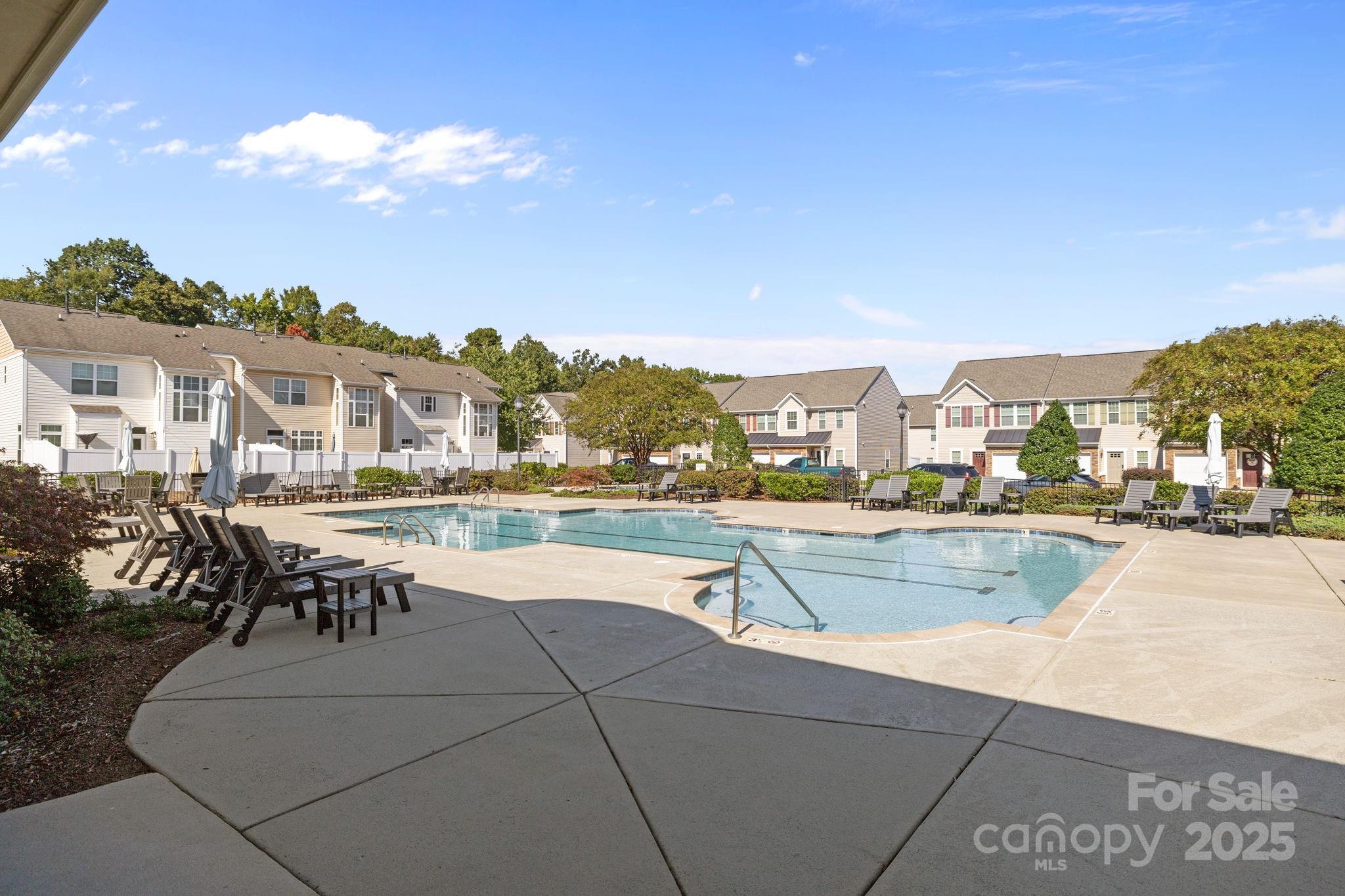 7443 Red Mulberry Way Charlotte, NC 28273 - Photo 9 of 45 a view of a swimming pool and outdoor seating