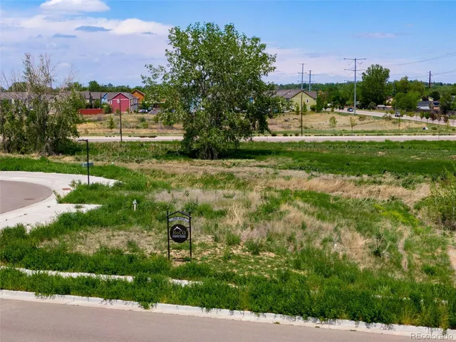 a wooden view of a lake with a yard