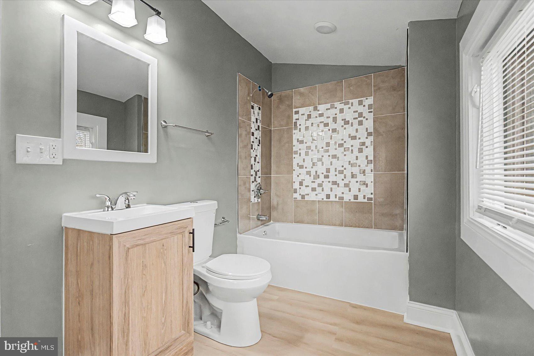 200 Pinewood Road Dundalk, MD 21222 - Photo 14 of 39 a bathroom with a sink toilet and shower