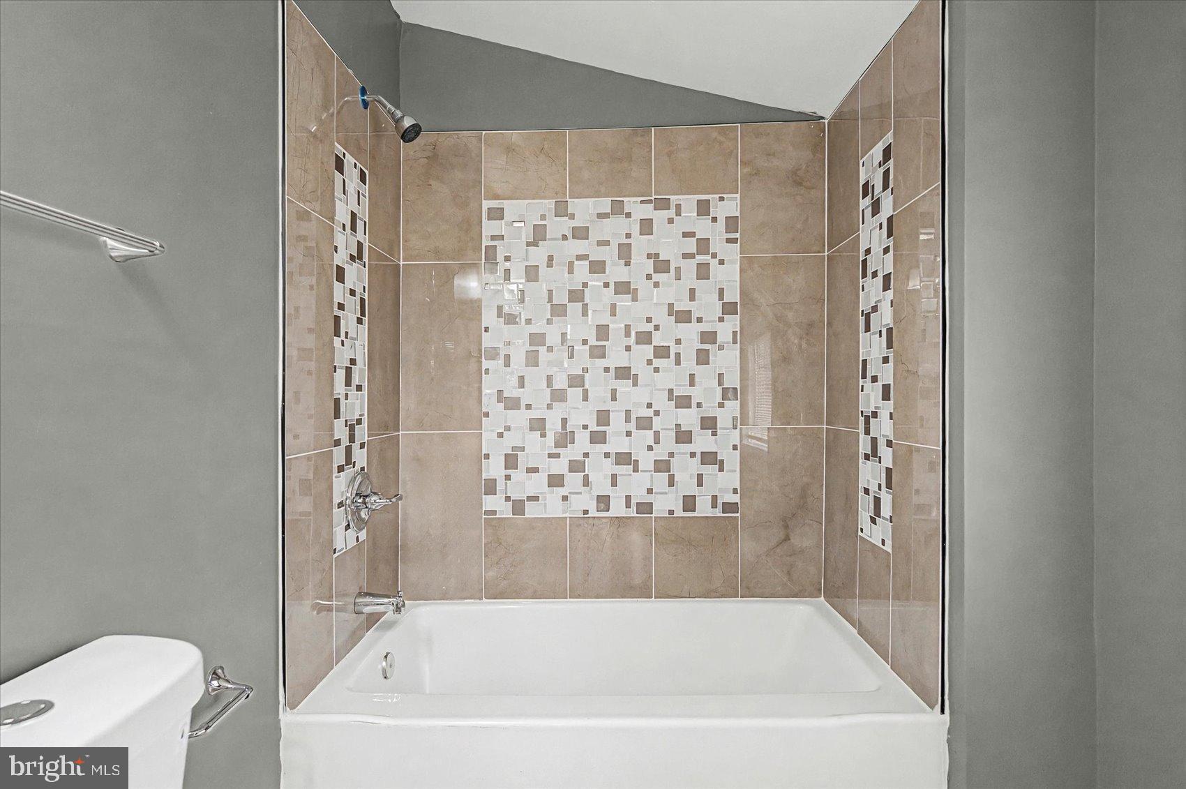 200 Pinewood Road Dundalk, MD 21222 - Photo 15 of 39 a bathroom with a bathtub and shower