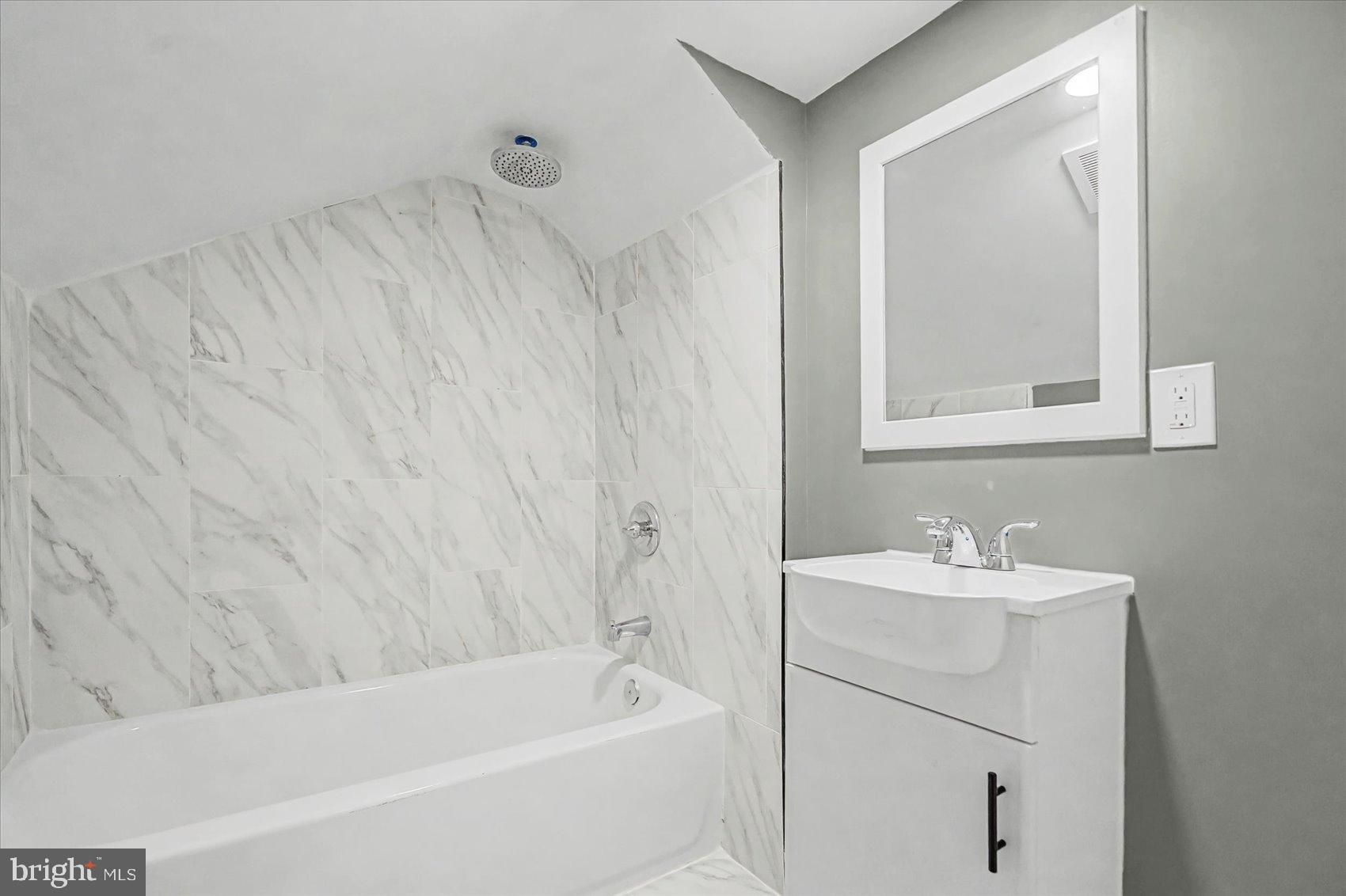 200 Pinewood Road Dundalk, MD 21222 - Photo 21 of 39 a bathroom with a sink and a bathtub