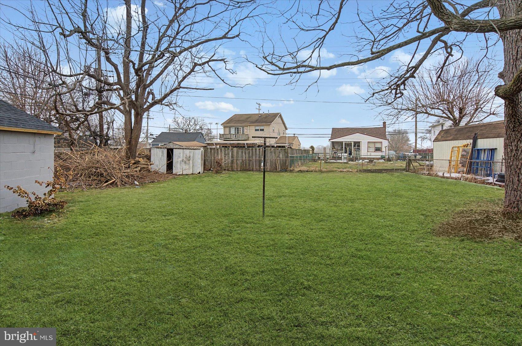 200 Pinewood Road Dundalk, MD 21222 - Photo 28 of 39 a view of a big yard next to a house