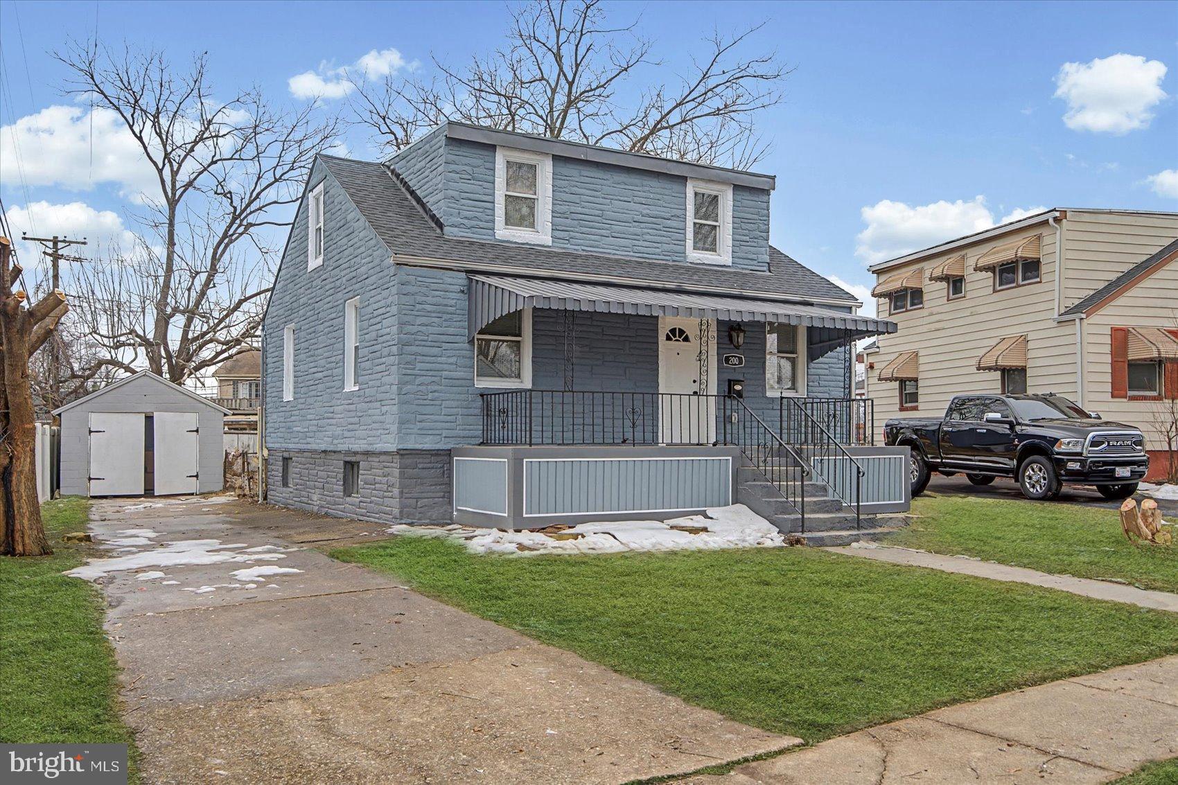 200 Pinewood Road Dundalk, MD 21222 - Photo 34 of 39 a front view of a house with a garden and yard