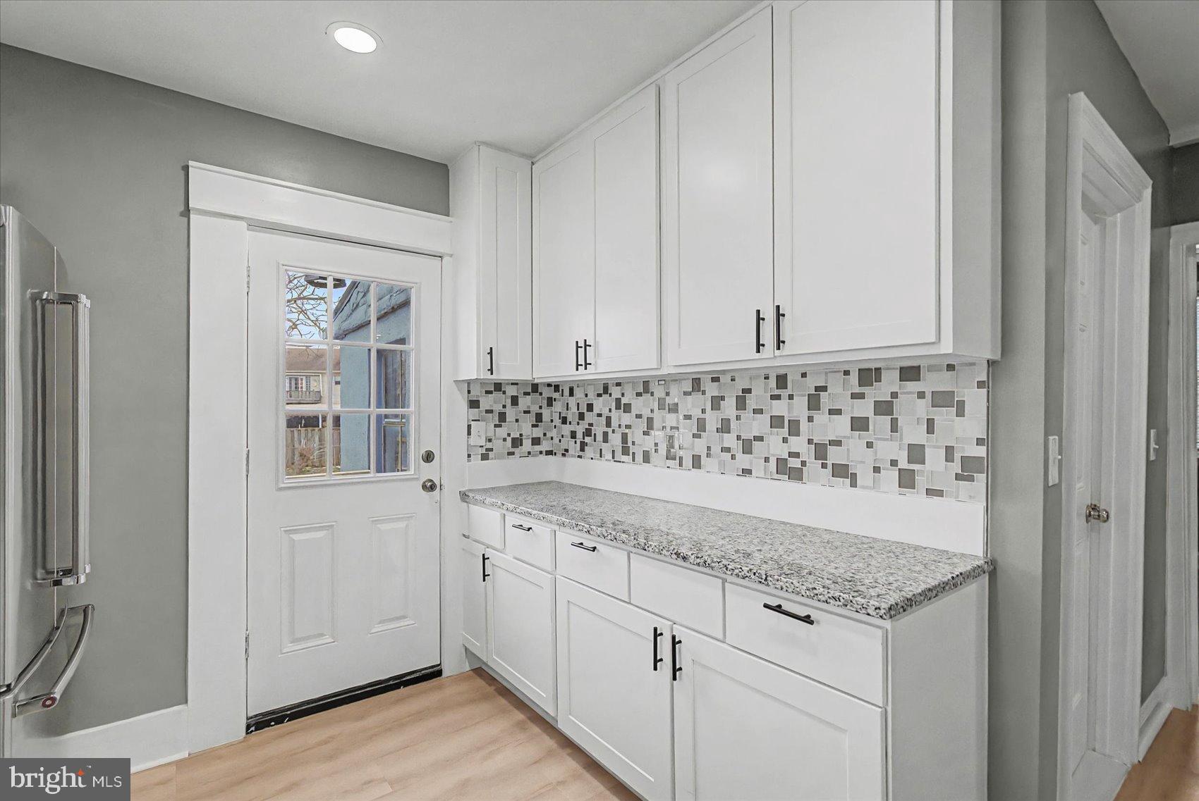 200 Pinewood Road Dundalk, MD 21222 - Photo 9 of 39 a view of a kitchen with sink and cabinets