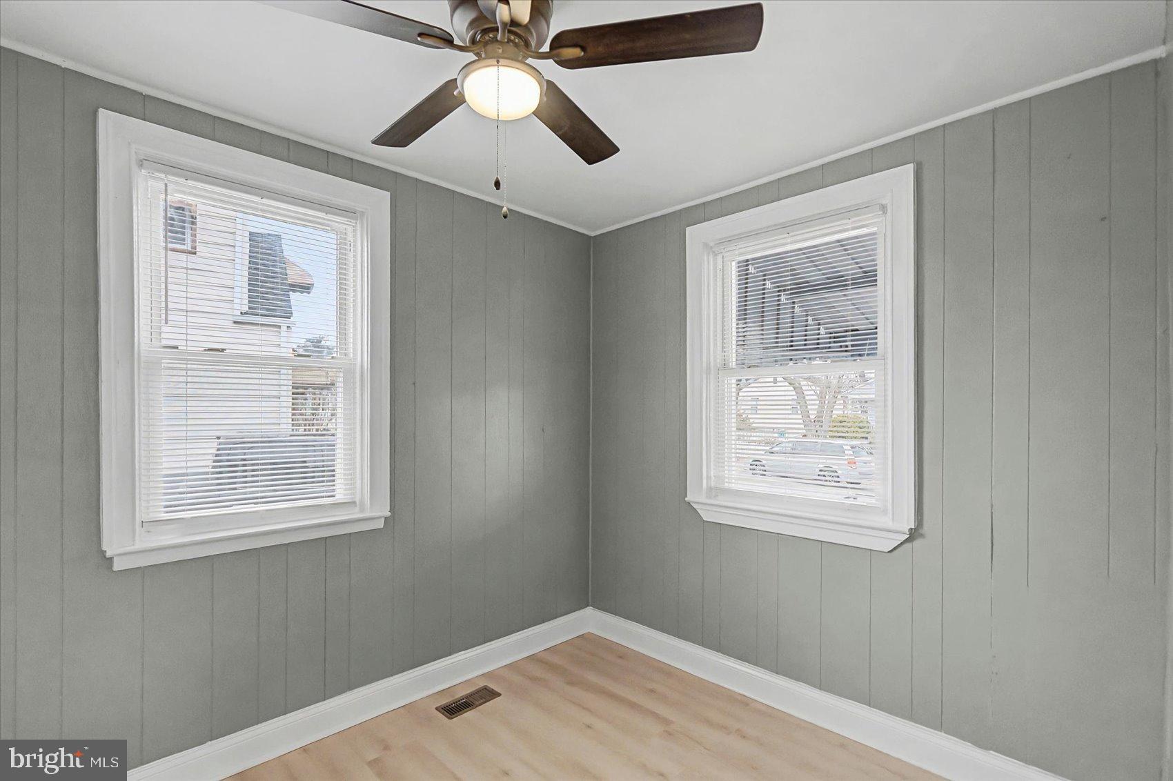 200 Pinewood Road Dundalk, MD 21222 - Photo 10 of 39 an empty room with windows and fan