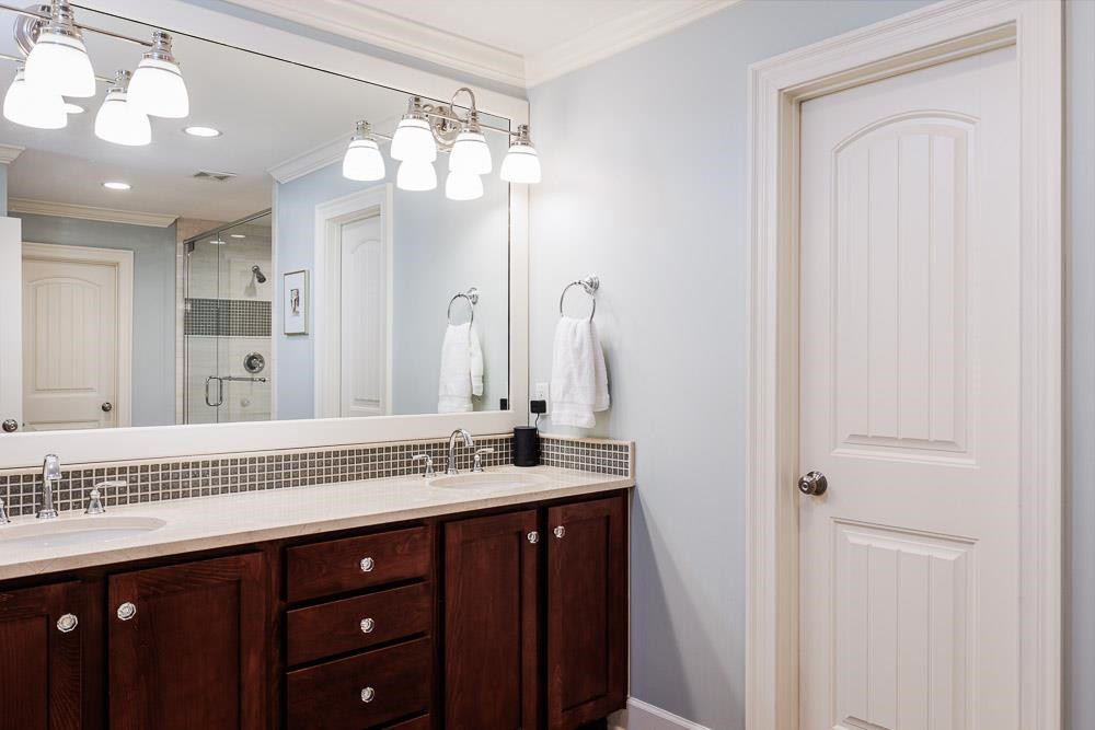 2309 Lowden Street Raleigh, NC 27608 - Photo 28 of 43 a bathroom with a sink vanity and a mirror