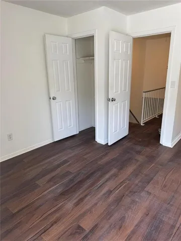 a view of a hallway with a dining room