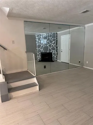 a view of empty room with fireplace