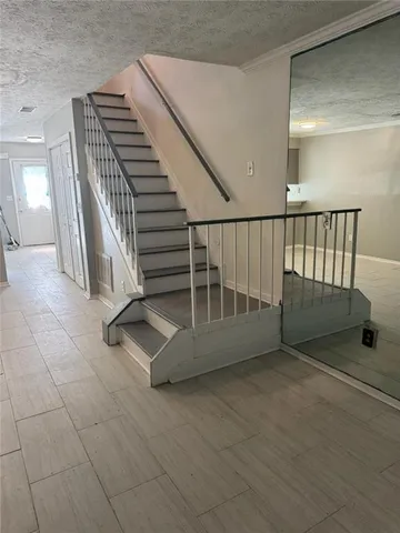 a view of an entryway with wooden floor