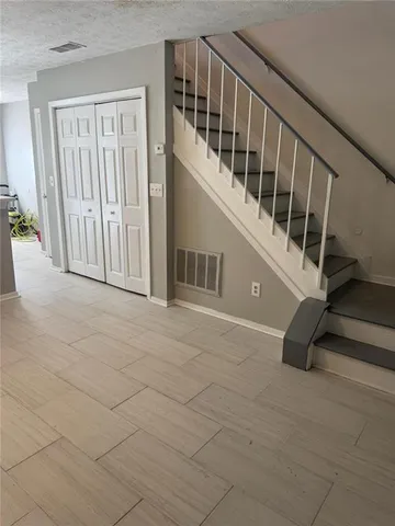 a kitchen with stainless steel appliances a stove and a refrigerator