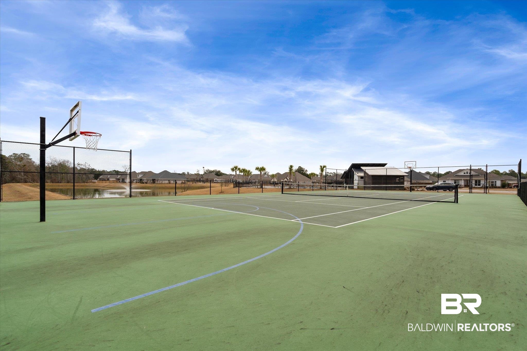 23246 Lieutenant Avenue Foley, AL 36535 - Photo 35 of 36 View of sport court with tennis court and a water view