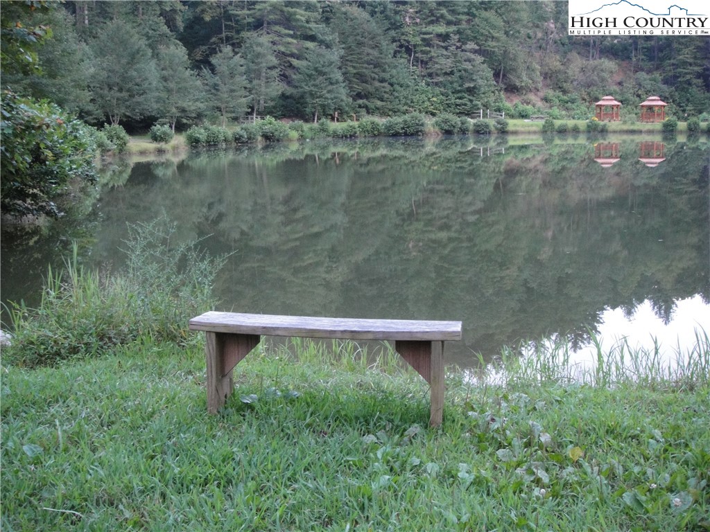 Lot 17 Wolf Pen Road Purlear, NC 28665 - Photo 15 of 25 a view of a yard with a bench and lake view