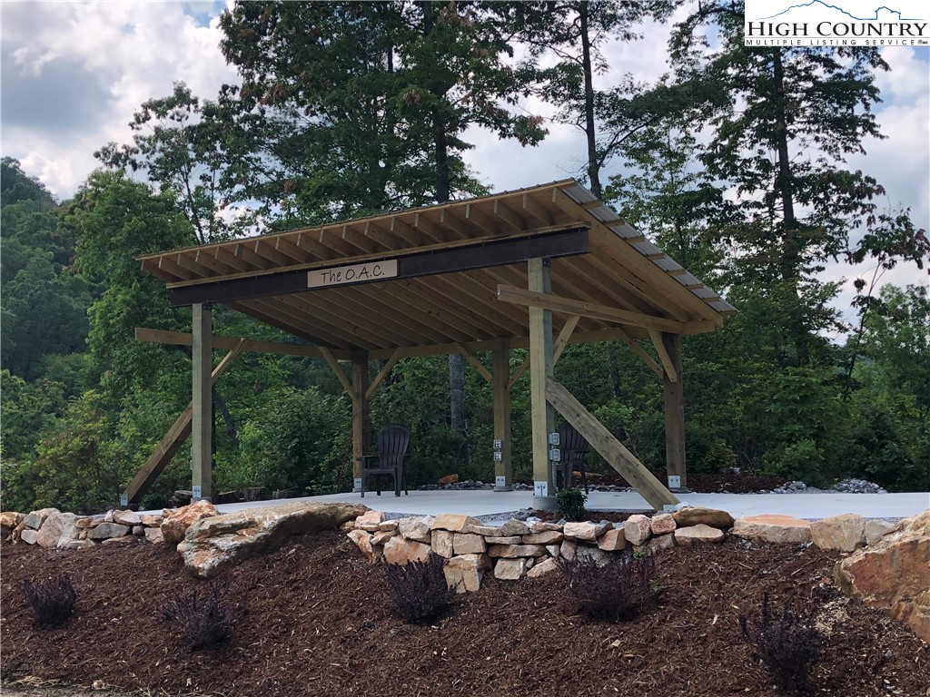 Lot 17 Wolf Pen Road Purlear, NC 28665 - Photo 18 of 25 a view of backyard with wooden deck and outdoor seating