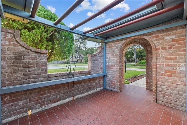 wooden floor in kitchen with a window