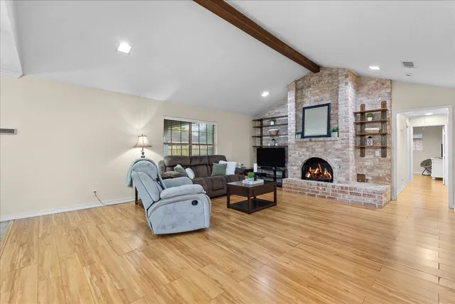 a kitchen with stainless steel appliances a refrigerator and a stove top oven