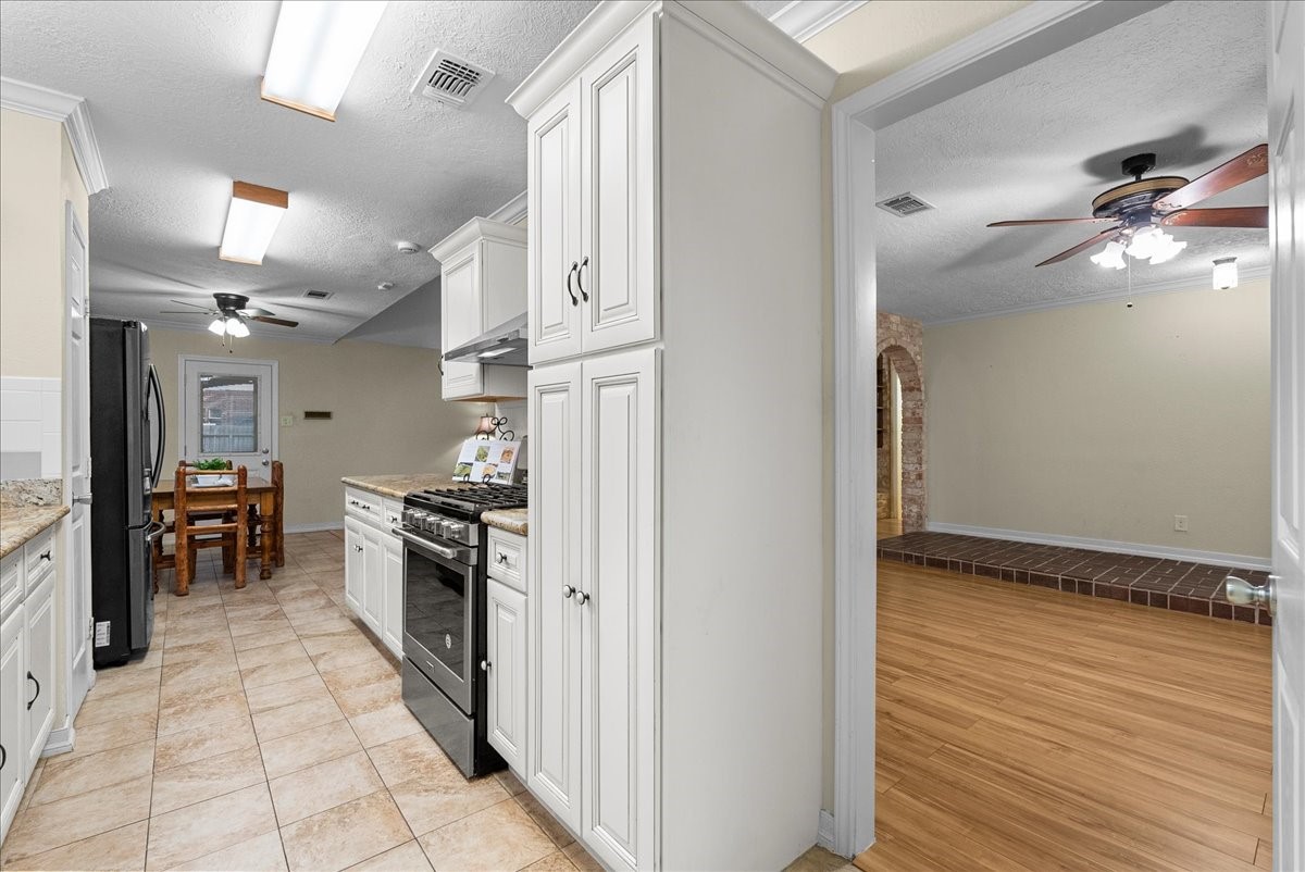 3727 Rau Drive Dickinson, TX 77539 - Photo 26 of 45 a kitchen with stainless steel appliances granite countertop a refrigerator and a sink