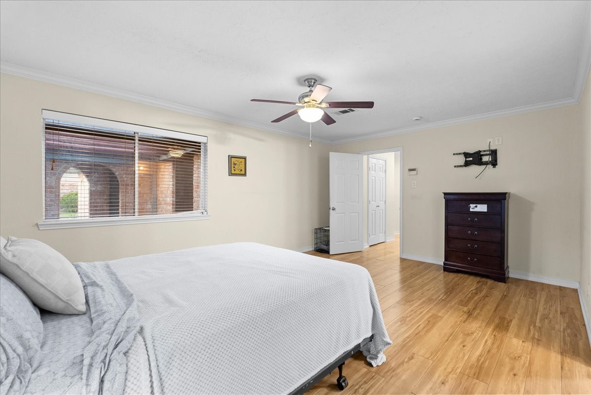 3727 Rau Drive Dickinson, TX 77539 - Photo 32 of 45 a bedroom with a bed and a chandelier