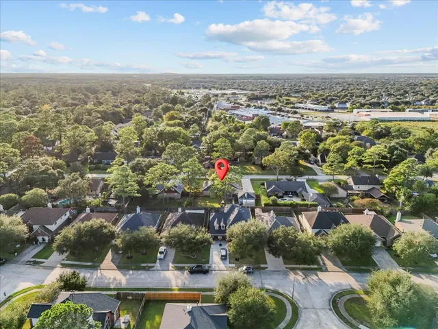 an aerial view of residential houses with outdoor space