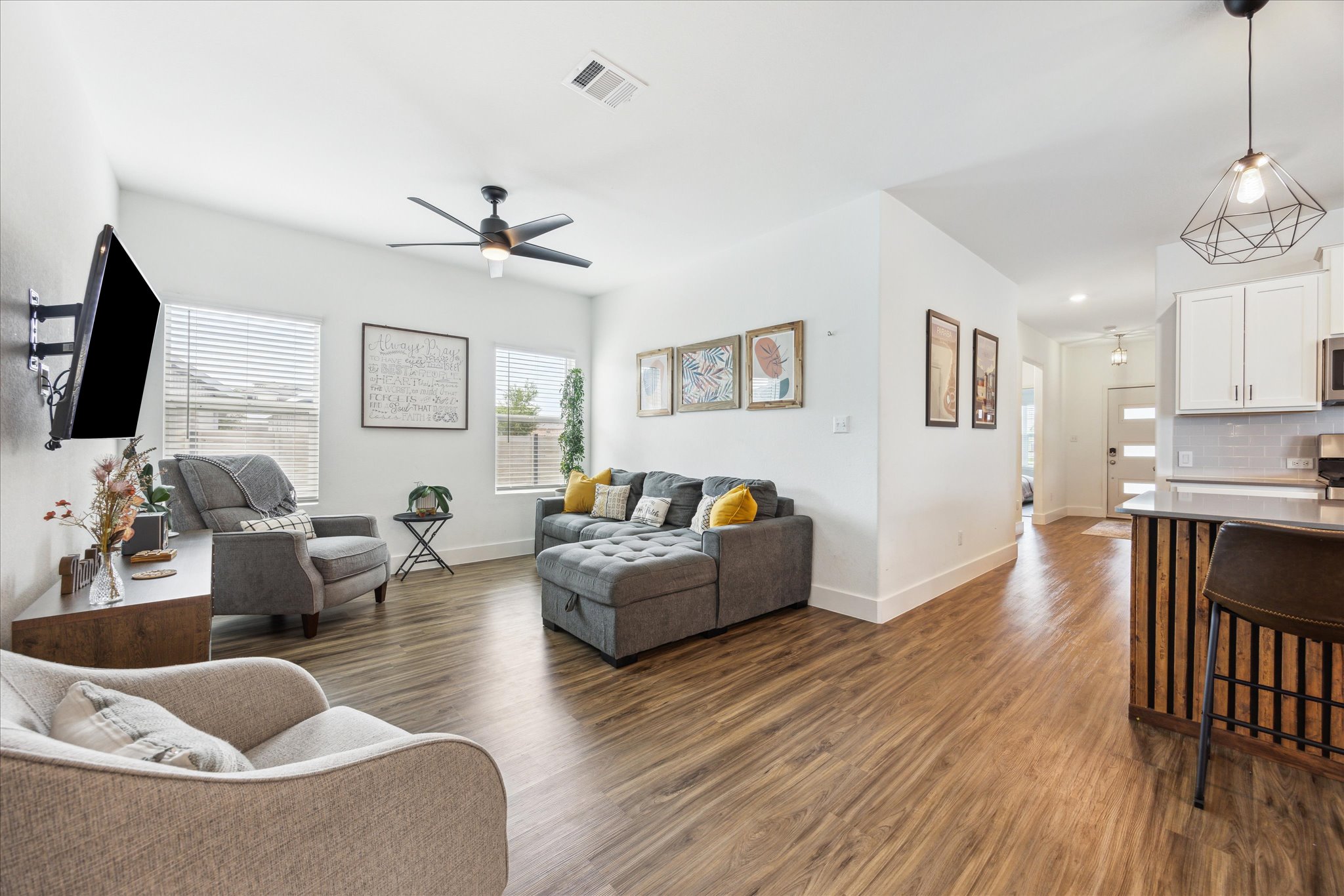 700 Legends Lane Georgetown, TX 78628 - Photo 11 of 31 Living area with dark wood-style flooring, ceiling fan, and baseboards