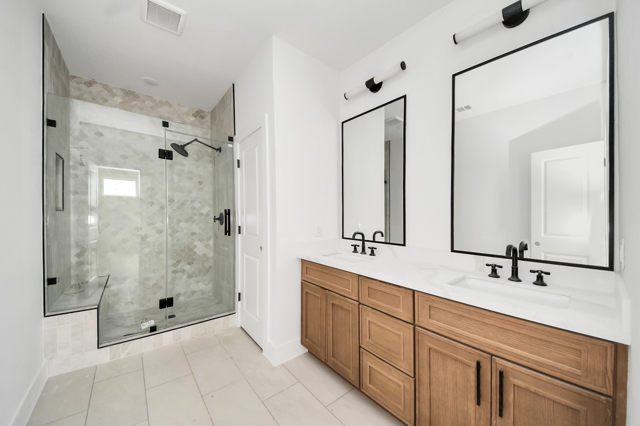 8206 Colonial Lane Houston, TX 77051 - Photo 27 of 31 a bathroom with a double vanity sink shower and mirror