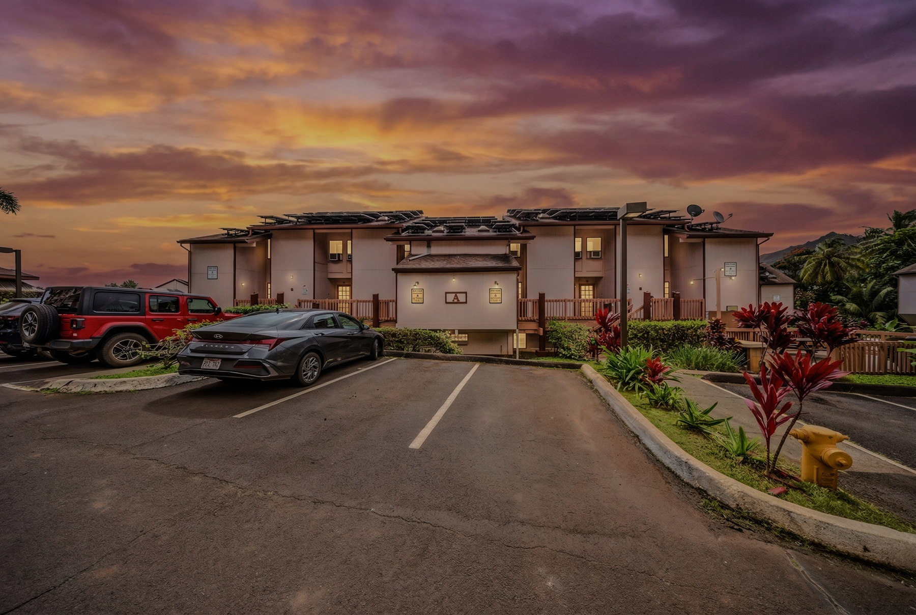 3411 Wilcox Road, Unit AIII9 Lihue, HI 96766 - Photo 2 of 13 a car parked in front of a house
