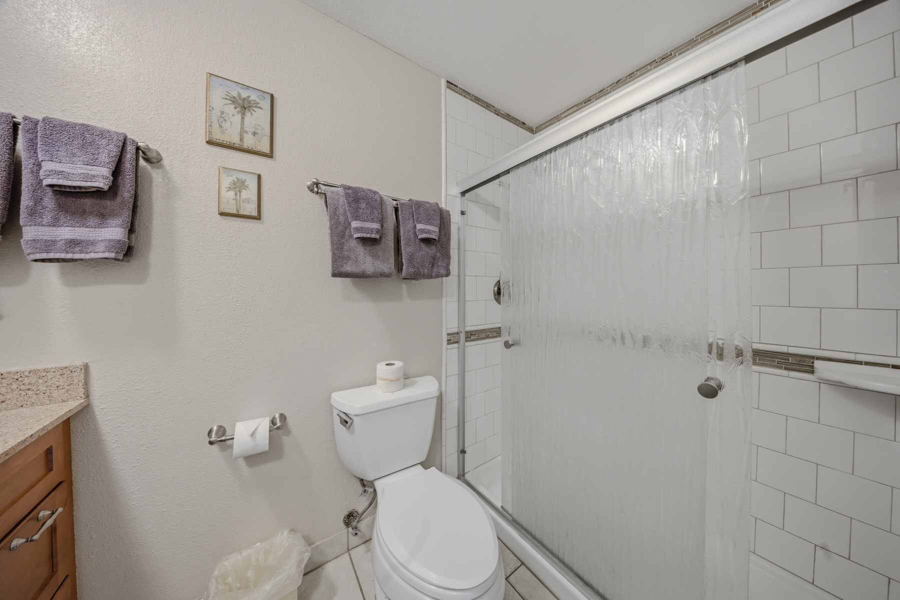 3411 Wilcox Road, Unit AIII9 Lihue, HI 96766 - Photo 8 of 13 a white toilet sitting next to a bathroom sink