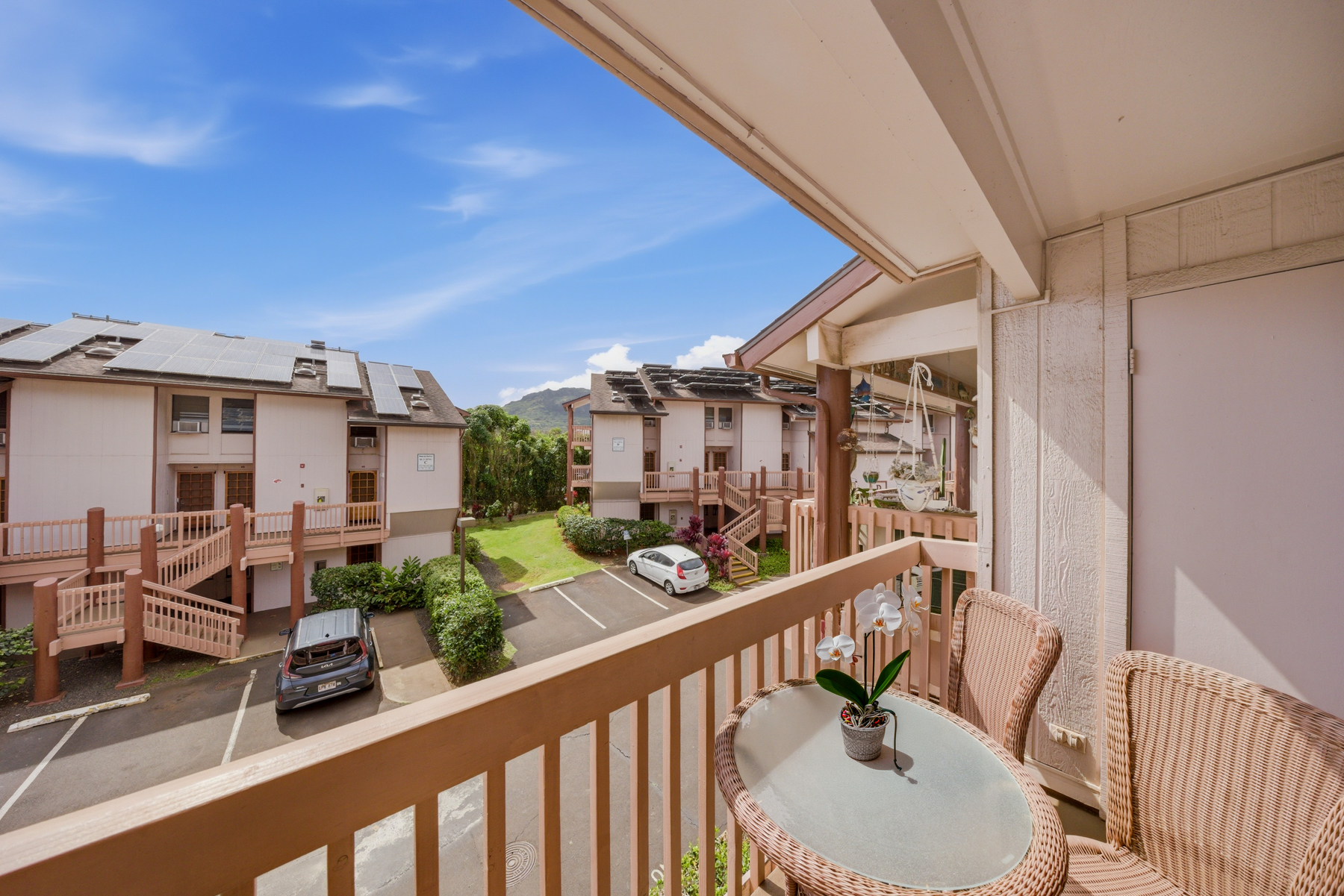 3411 Wilcox Road, Unit AIII9 Lihue, HI 96766 - Photo 10 of 13 a view of a balcony dining table and chairs