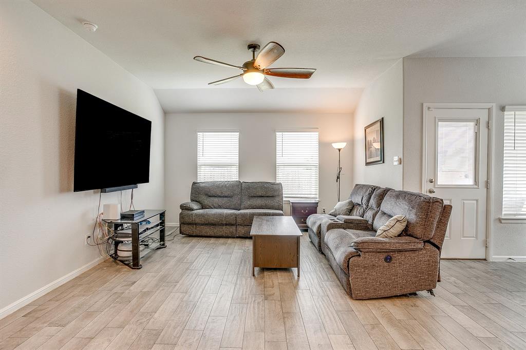 2313 Stallings Road Fort Worth, TX 76108 - Photo 5 of 30 a living room with furniture and a flat screen tv