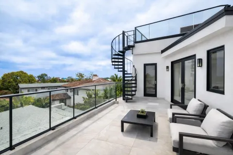 a balcony with furniture and city view