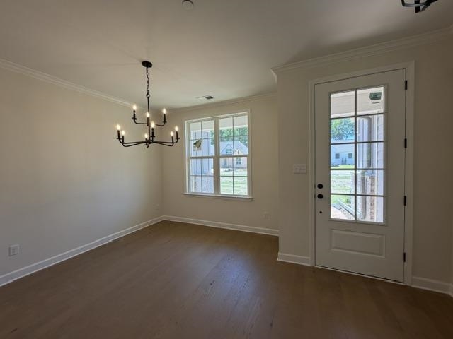 210 Drake Drive Collierville, TN 38017 - Photo 4 of 19 an empty room with windows and chandelier