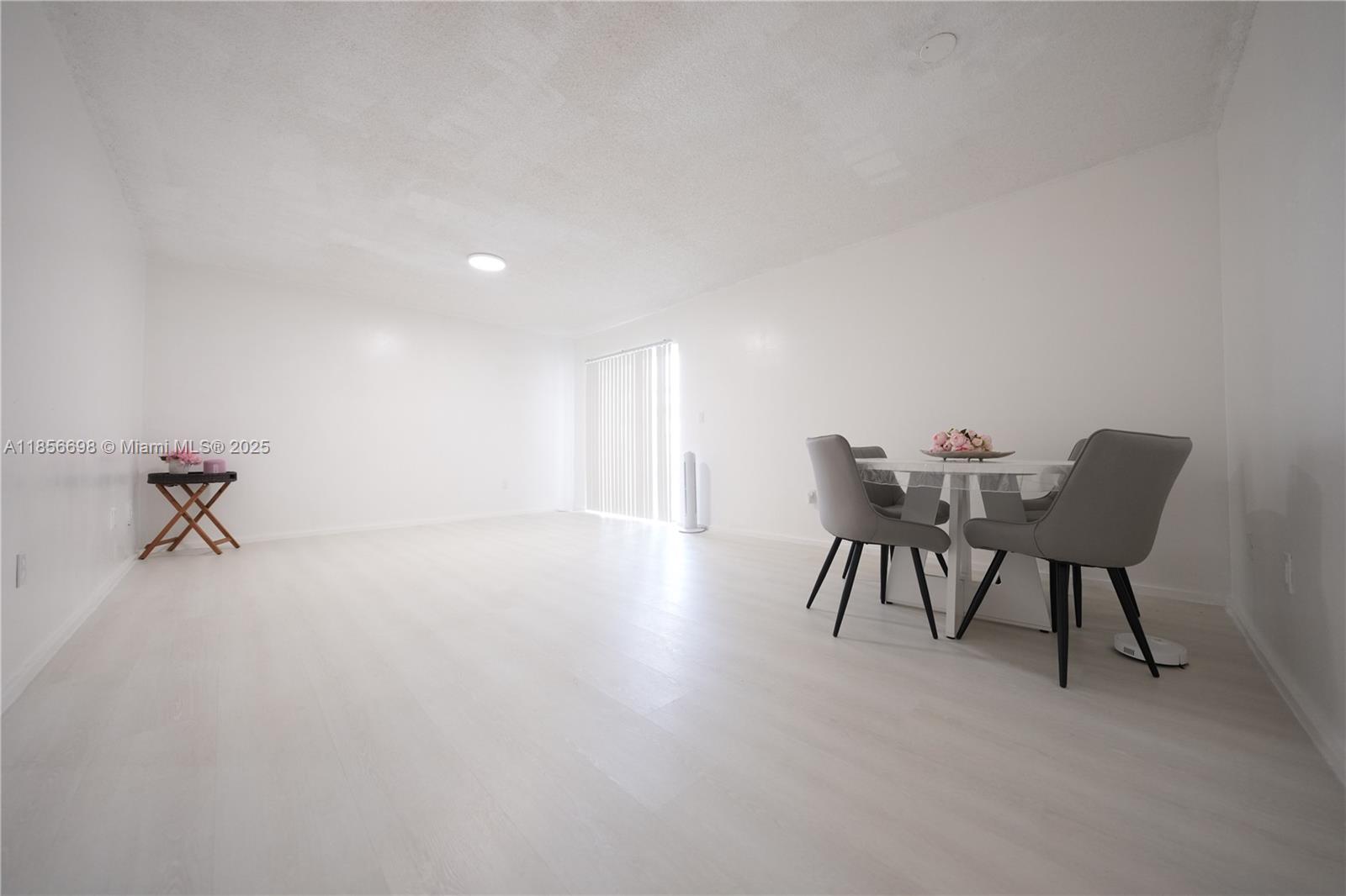 21121 Southwest 85th Avenue, Unit 117 Cutler Bay, FL 33189 - Photo 7 of 15 a view of a work space with table and chairs