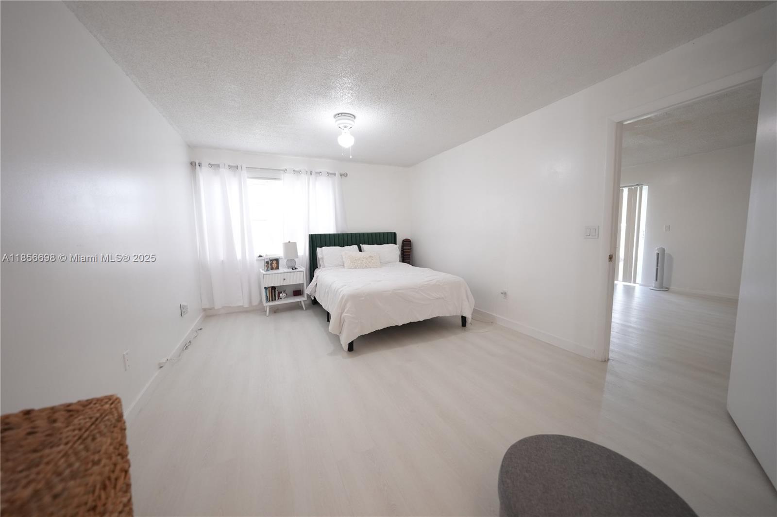 21121 Southwest 85th Avenue, Unit 117 Cutler Bay, FL 33189 - Photo 10 of 15 a bed room with a bed and a couch