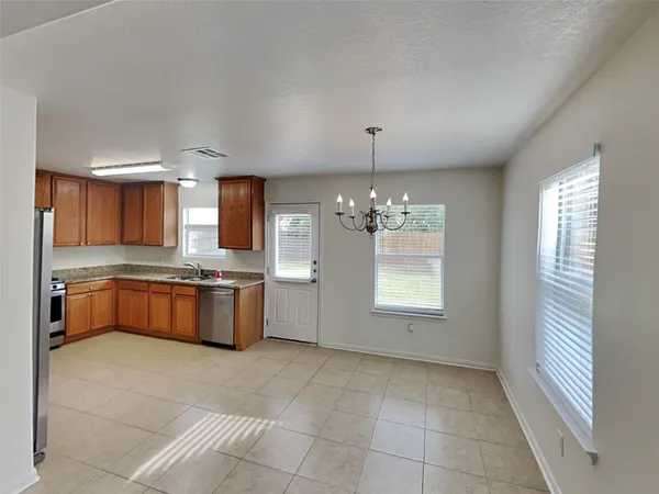 a large kitchen with kitchen island granite countertop a large counter top and sink