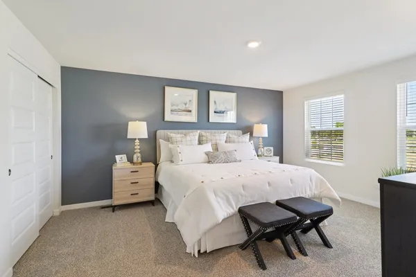 a bed room with furniture and a window