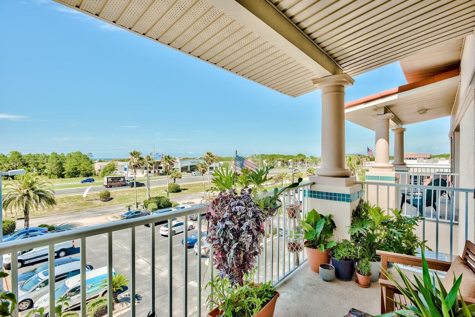 4507 Furling Lane, Unit 302 Destin, FL 32541 - Photo 14 of 15 a view of a balcony with many potted plants