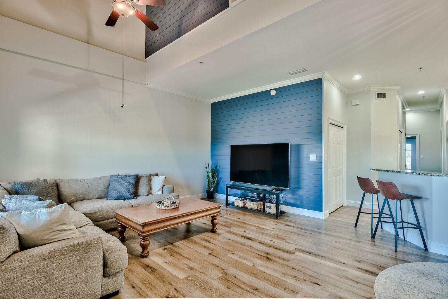 4507 Furling Lane, Unit 302 Destin, FL 32541 - Photo 3 of 15 a living room with furniture and a flat screen tv