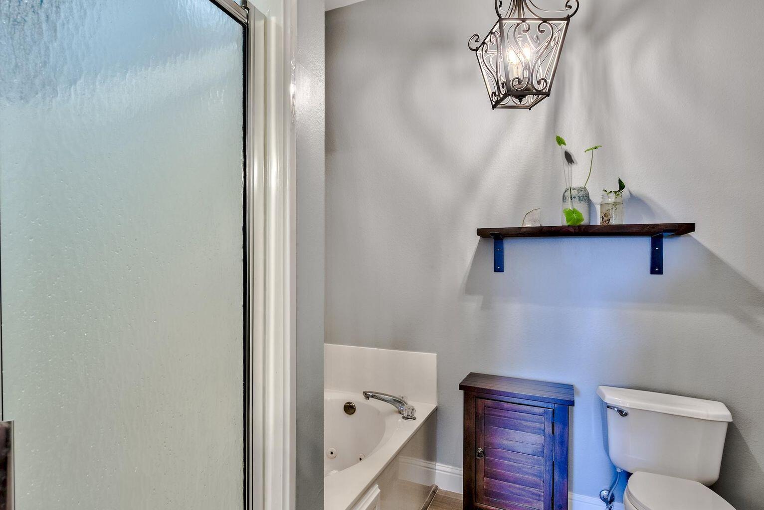 4507 Furling Lane, Unit 302 Destin, FL 32541 - Photo 10 of 15 a bathroom with a toilet and a sink
