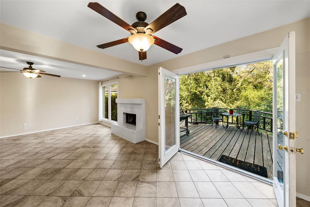 3825 North 30th Street Waco, TX 76708 - Photo 13 of 39 Main living. Fireplace. Double doors to deck