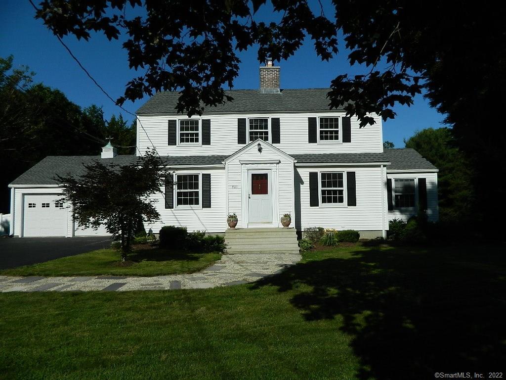 985 Garden Road Orange, CT 06477 - Photo 1 of 1 a front view of a house with a garden