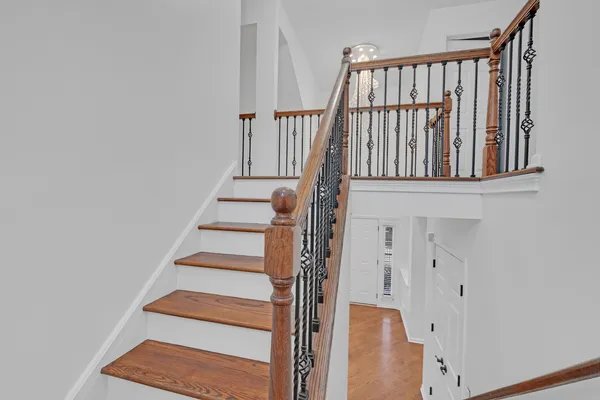 a view of staircase with white walls