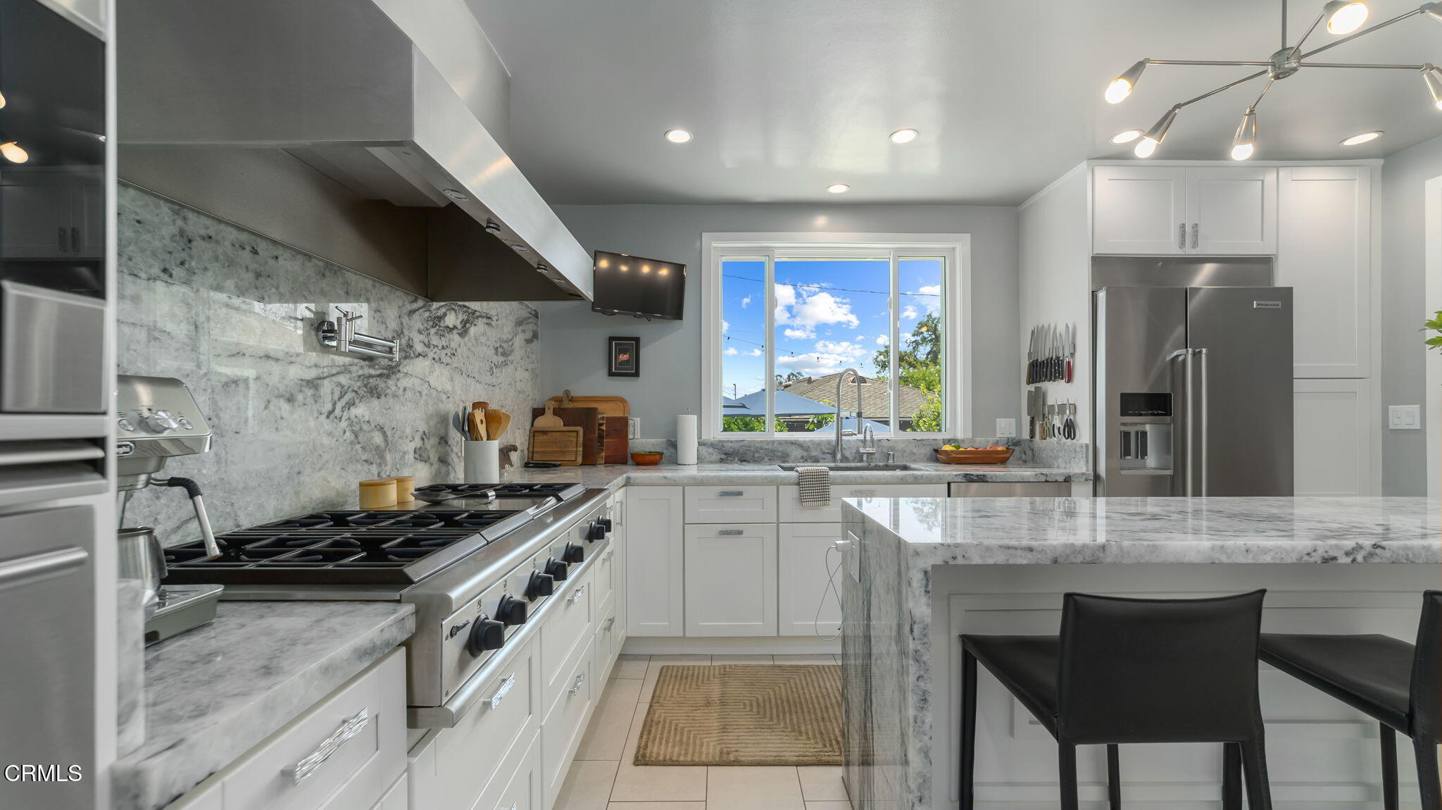 2030 North Altadena Drive Pasadena, CA 91107 - Photo 14 of 61 a kitchen with a sink stove and cabinets