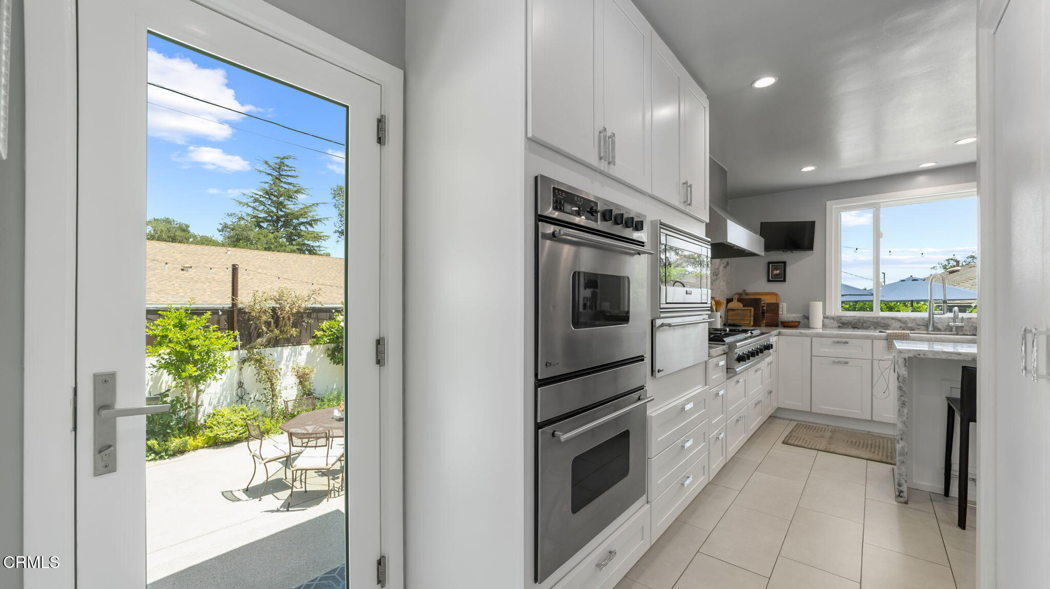 2030 North Altadena Drive Pasadena, CA 91107 - Photo 18 of 61 a kitchen with white cabinets and white appliances