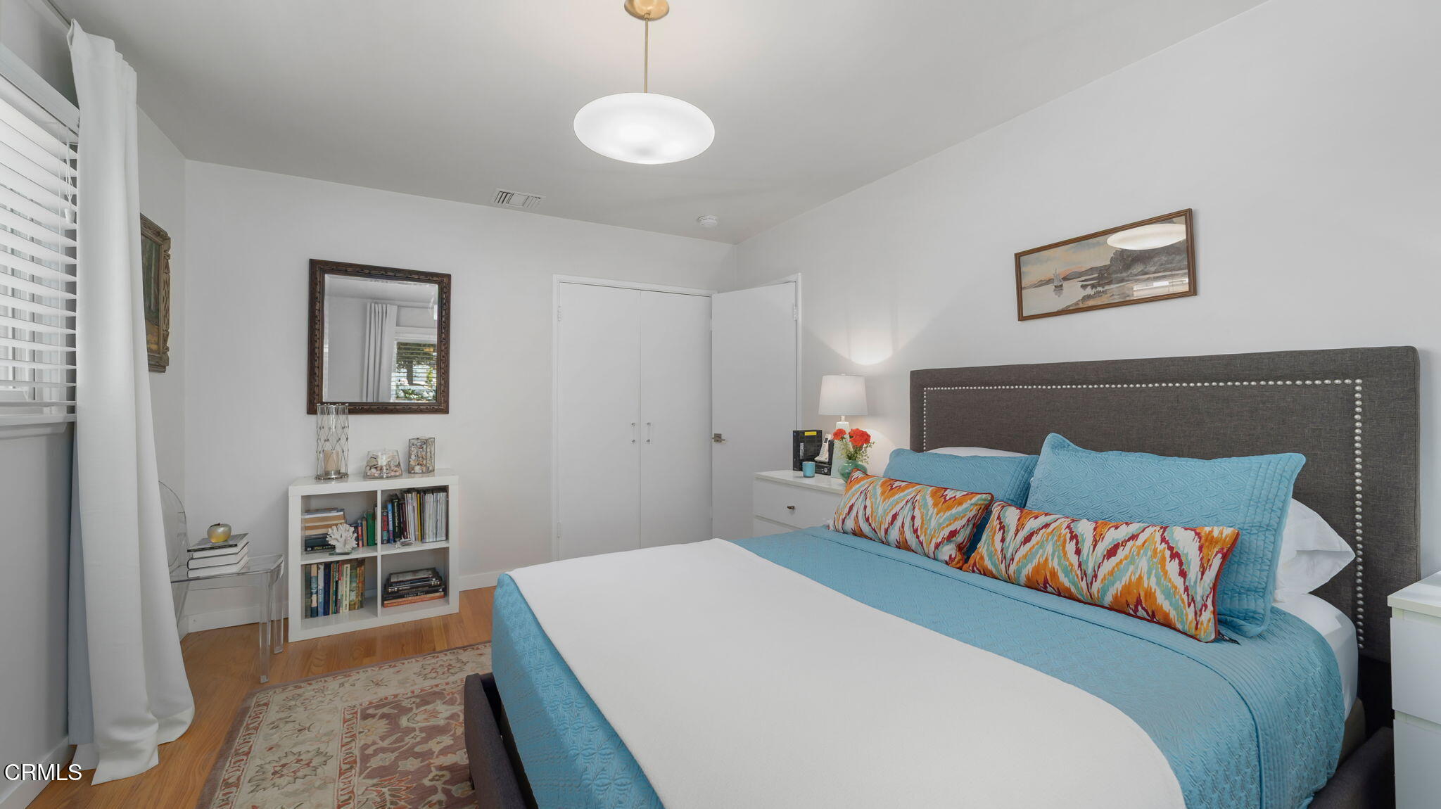 2030 North Altadena Drive Pasadena, CA 91107 - Photo 26 of 61 a bedroom with a large bed and a chandelier