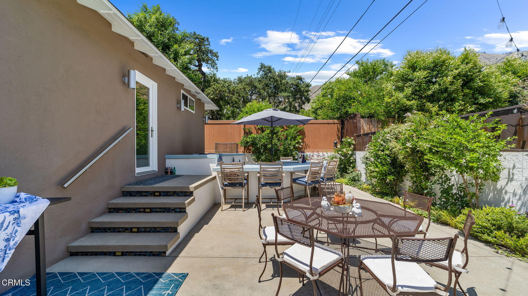 2030 North Altadena Drive Pasadena, CA 91107 - Photo 39 of 61 a view of a patio with table and chairs and potted plants with wooden floor