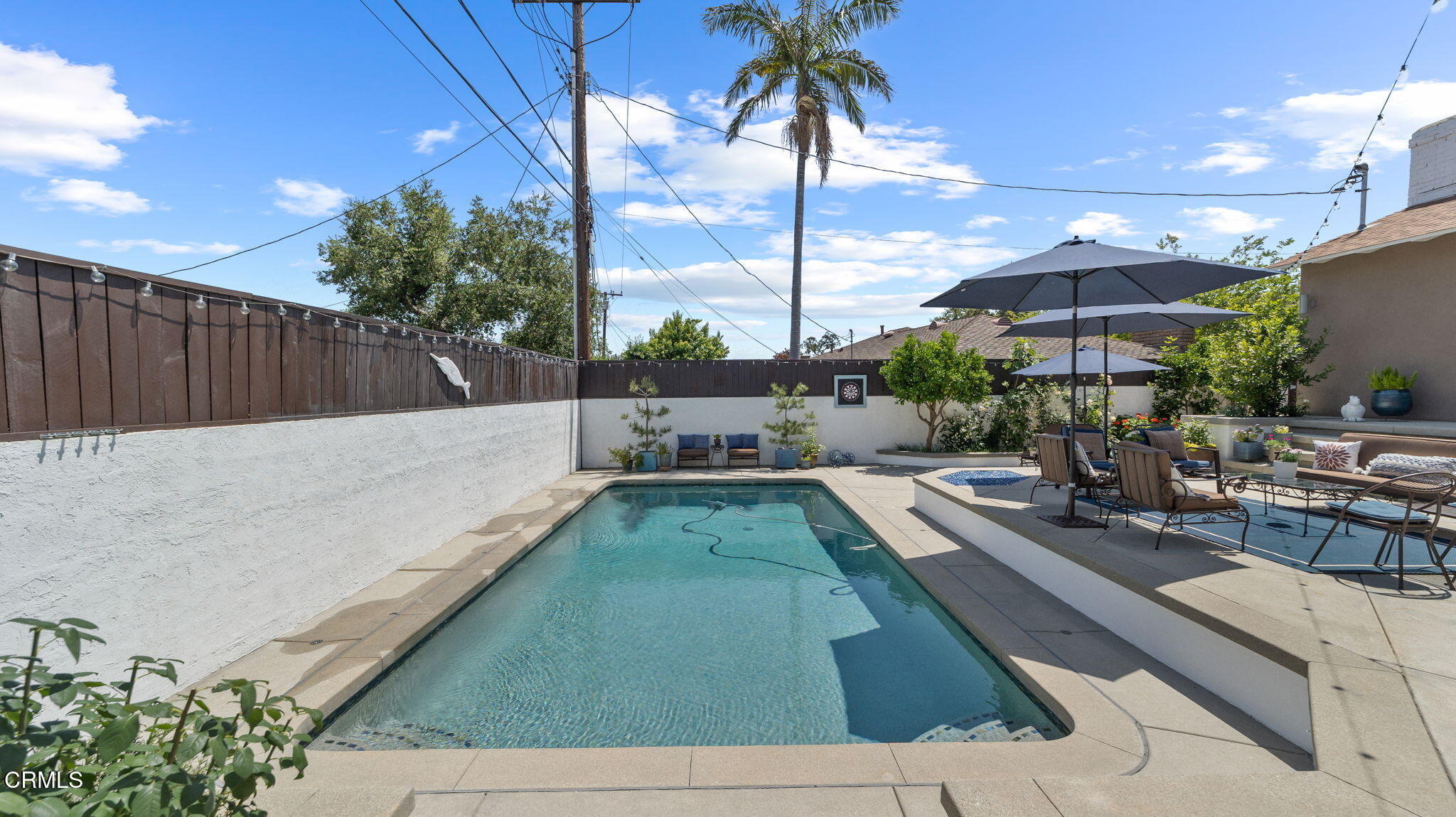 2030 North Altadena Drive Pasadena, CA 91107 - Photo 42 of 61 a swimming pool with outdoor seating and yard
