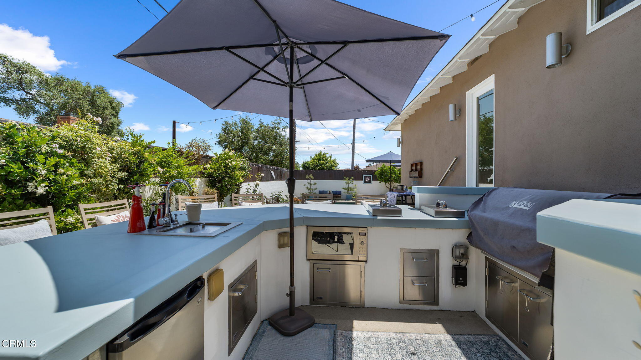 2030 North Altadena Drive Pasadena, CA 91107 - Photo 48 of 61 a kitchen with a sink a stove and chairs
