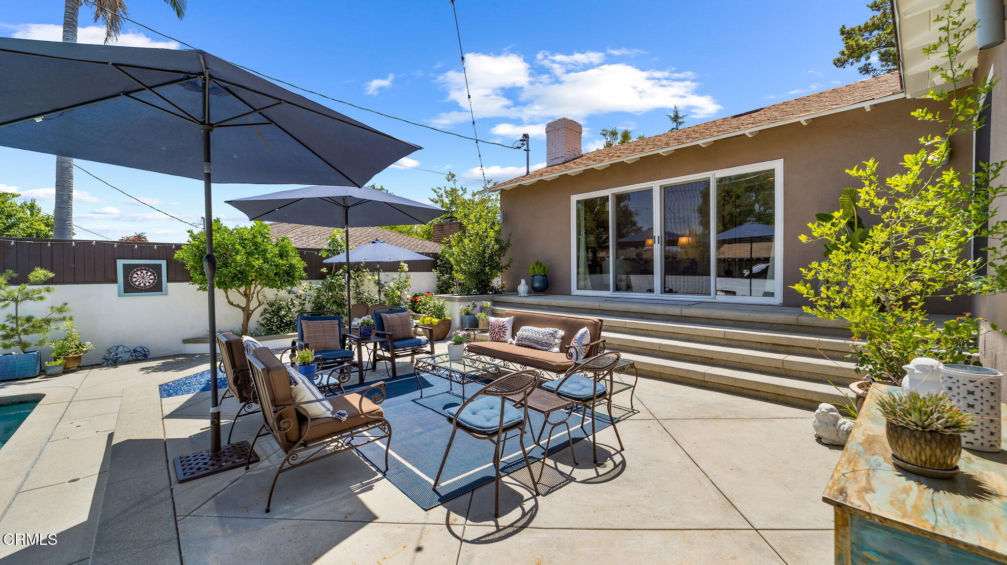 2030 North Altadena Drive Pasadena, CA 91107 - Photo 50 of 61 a view of a patio with table and chairs under an umbrella